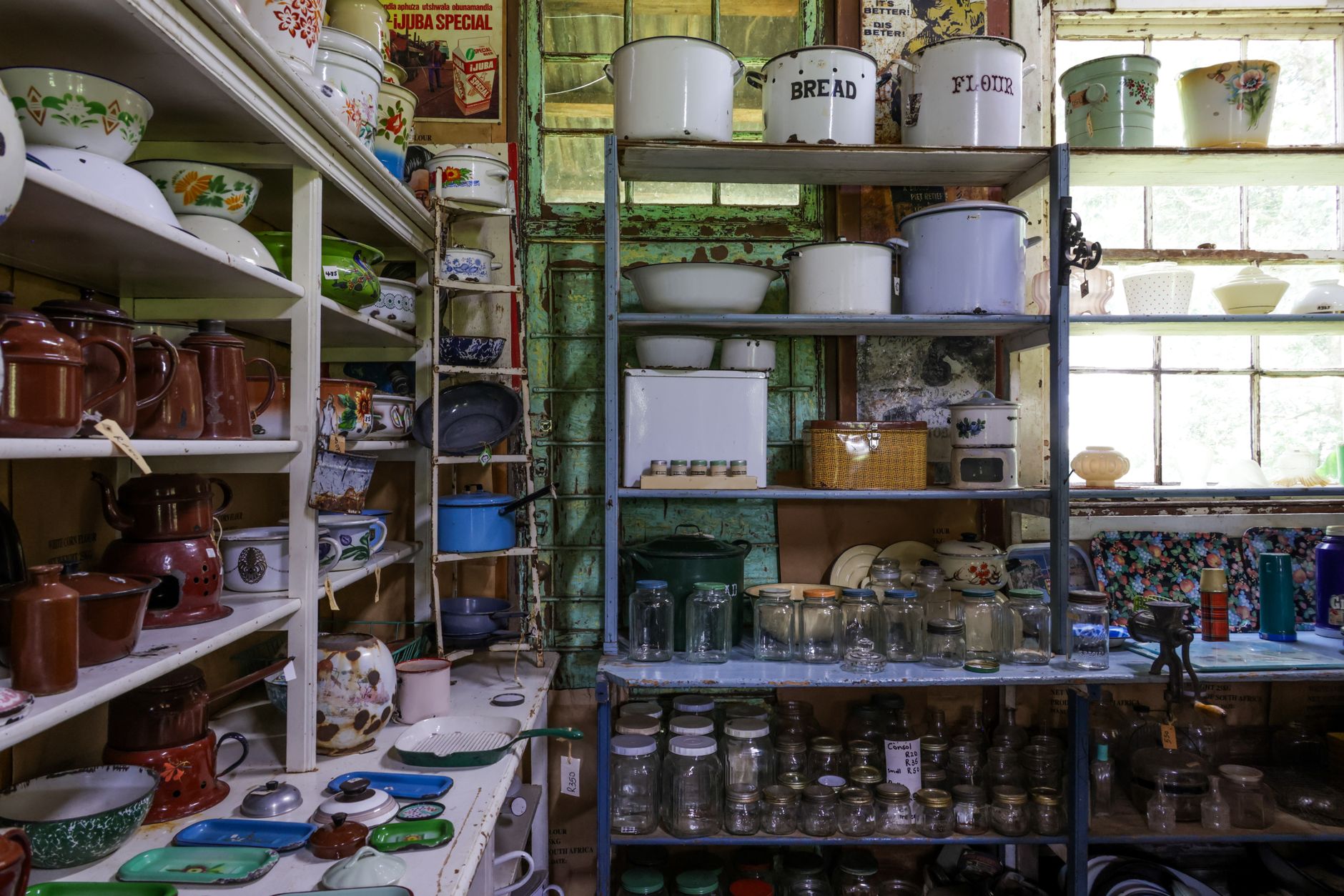 Authentic vintage kitchenware displayed in a rustic, nostalgic shop setting. Ideal for retro themes.